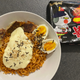 Samyang Buldak Hot Chicken ramyeon, prepared with melted mozzarella to temper the spiciness